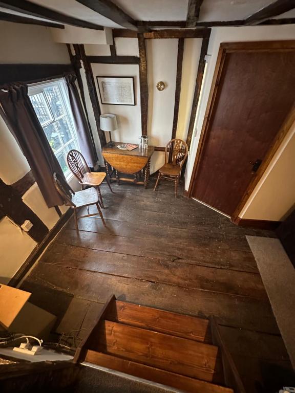 Traditional sitting area with timber beams and wooden floors