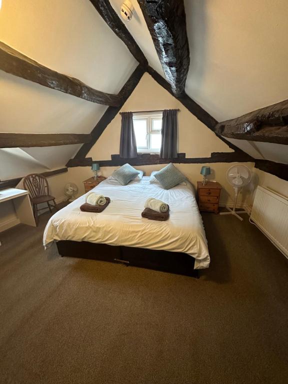 Deluxe Double Room with extra-large bed and exposed timber beams