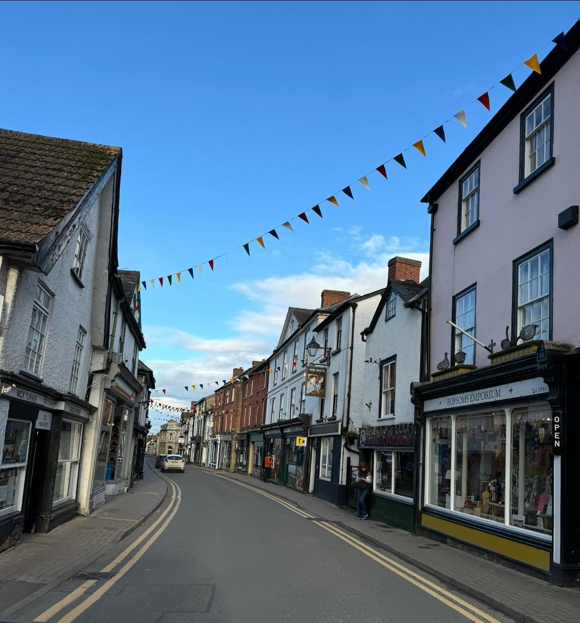 Kington High Street with bunting and historic buildings