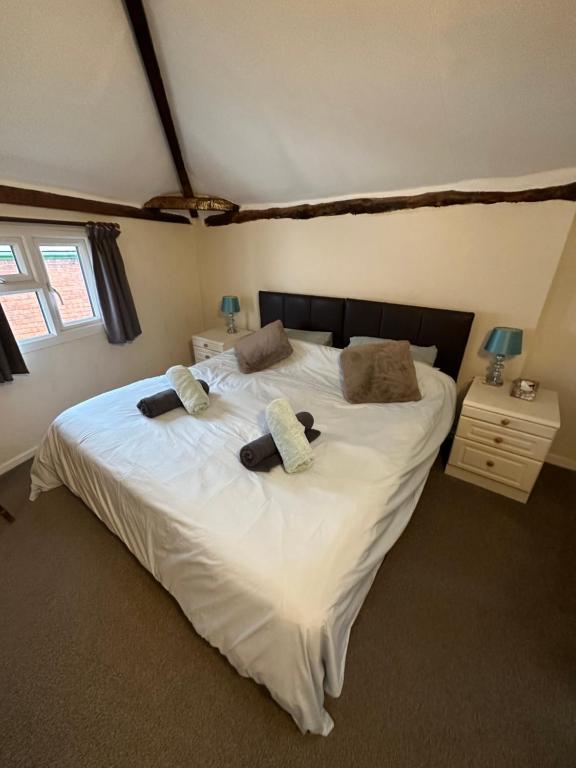 Comfortable double bed with bedside tables and lamps